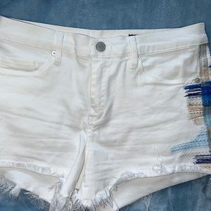 White denim shorts with design